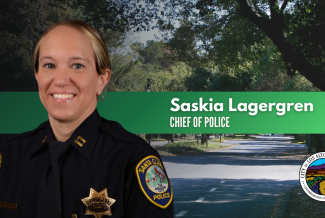 Saskia Lagergren Chief of Police Woman in police uniform behind her a street filled with trees